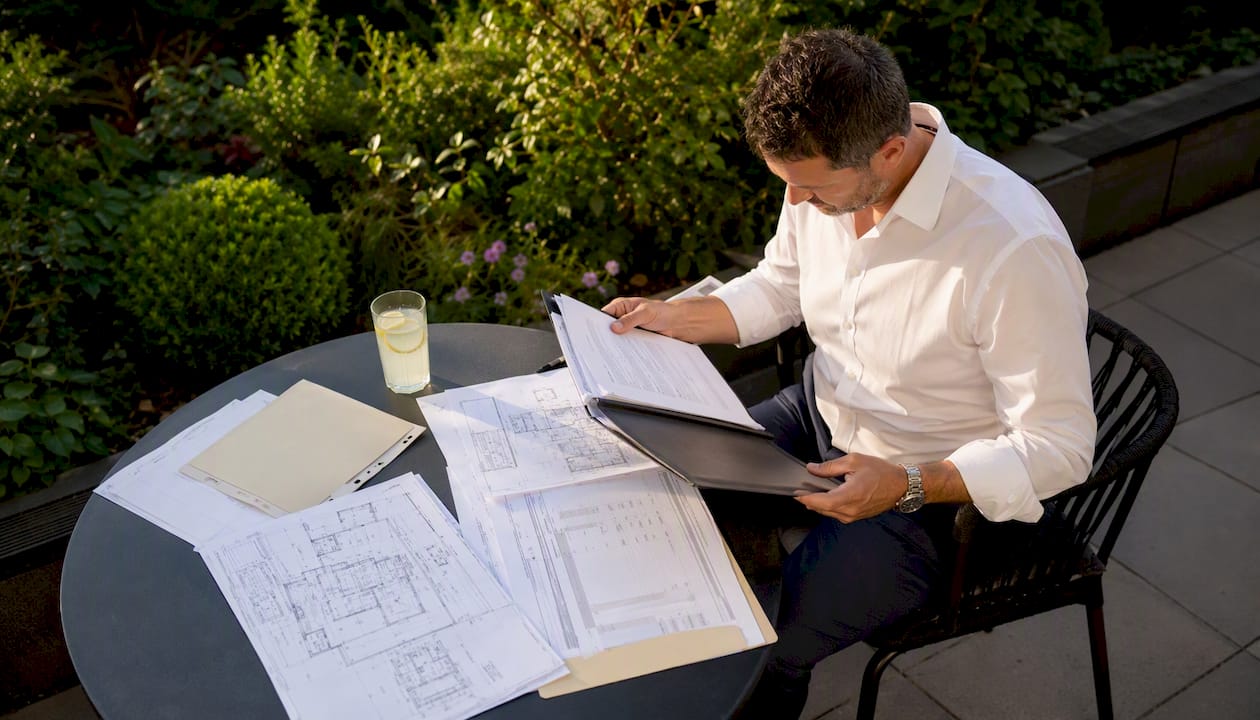 Business owner reviewing refurbishment plans