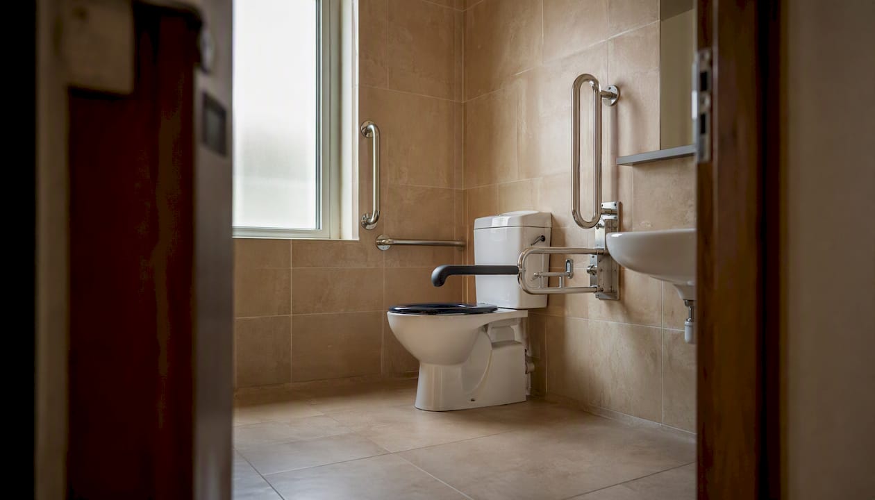Inside wheelchair-accessible unisex toilet