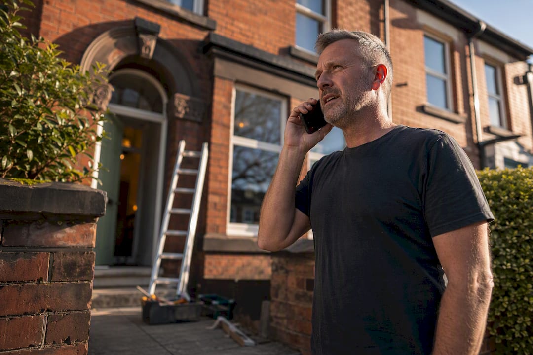 Homeowner verifying builder insurance by phone