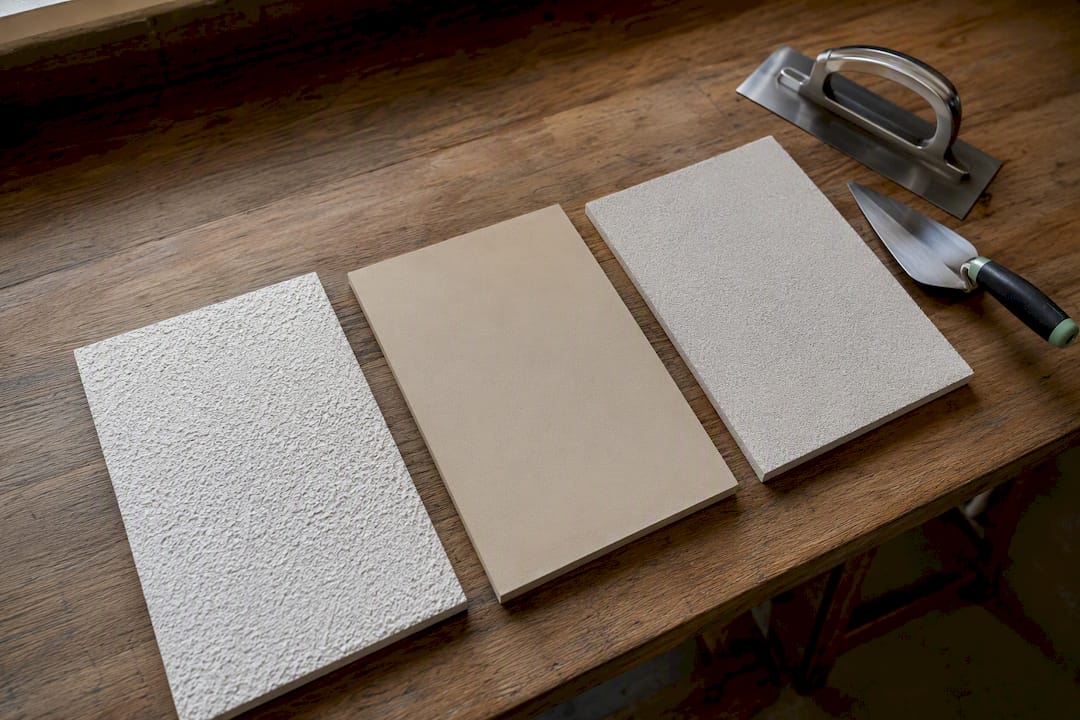 Three render finish sample panels